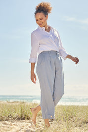 Model Lala wearing size 10 of the Linen Cotton 7/8 Pant in colour Chambray (Blue), from the front, showing the whole outfit