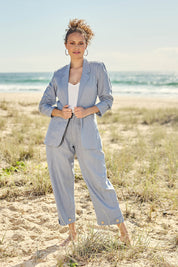 Model Lala wearing size 10 of the Linen Cotton 7/8 Pant in colour Chambray (Blue), from the front, showing the whole outfit