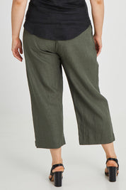 Model Keeara wearing size 16 of the Linen Cotton 7/8 Pant in colour Olive (Green), from the back