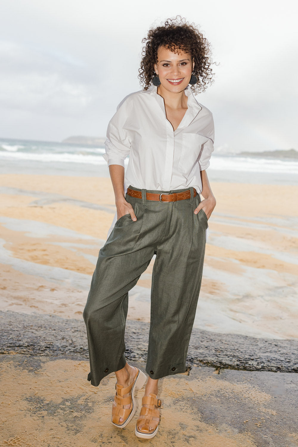 Model Lala wearing size 10 of the Linen Cotton 7/8 Pant in colour Olive (Green), from the front, showing the whole outfit