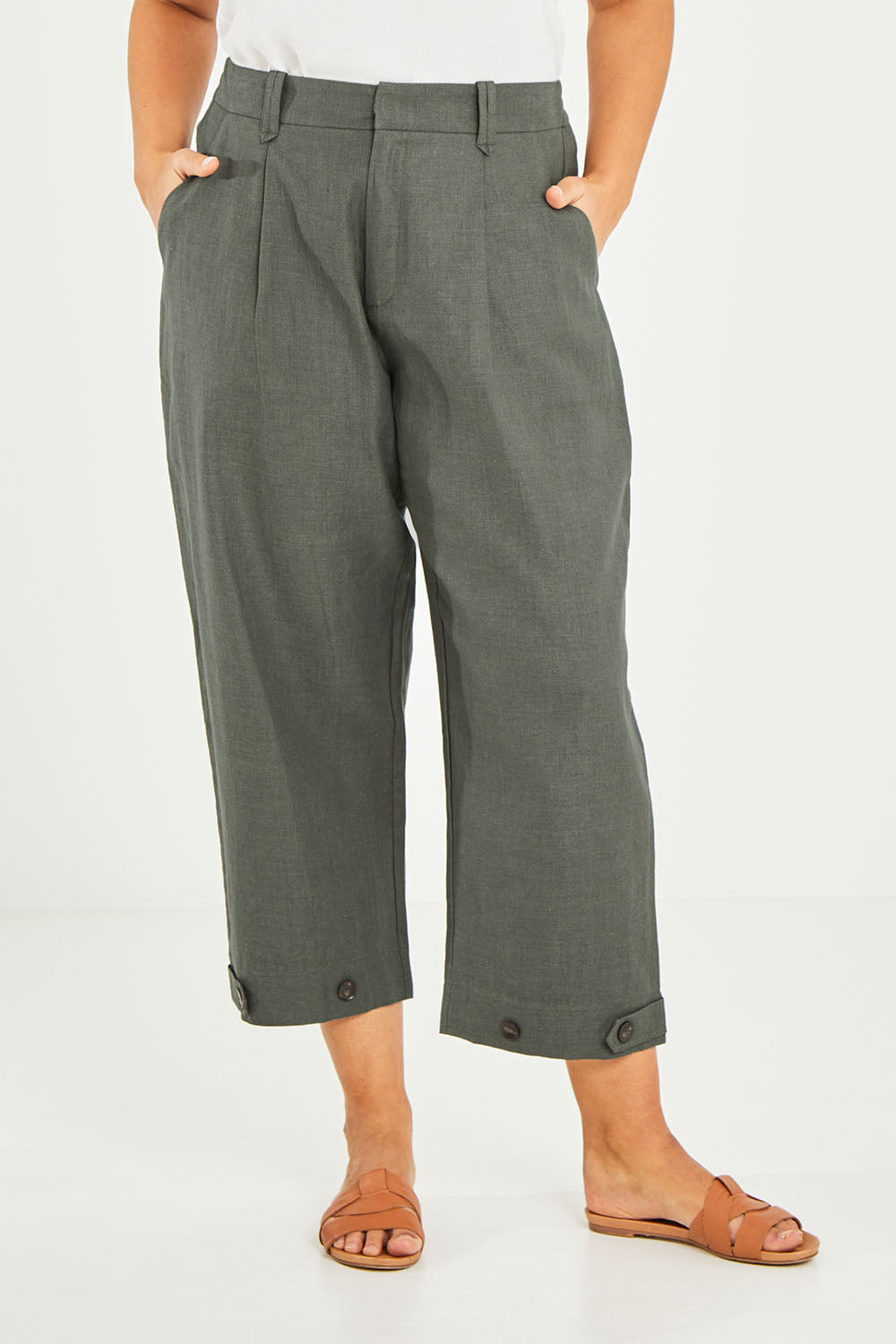 Model Terri-Leigh wearing size 14 of the Linen Cotton 7/8 Pant in colour Olive (Green), from the front, cropped image