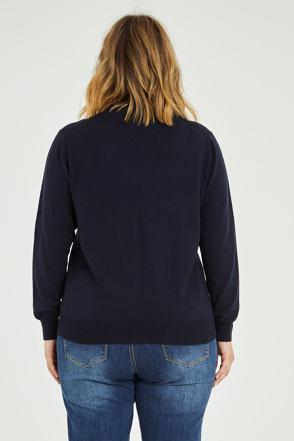 Model Jess wearing size L of the Merino Wool High Crew Pullover in colour Navy (Blue), from the back