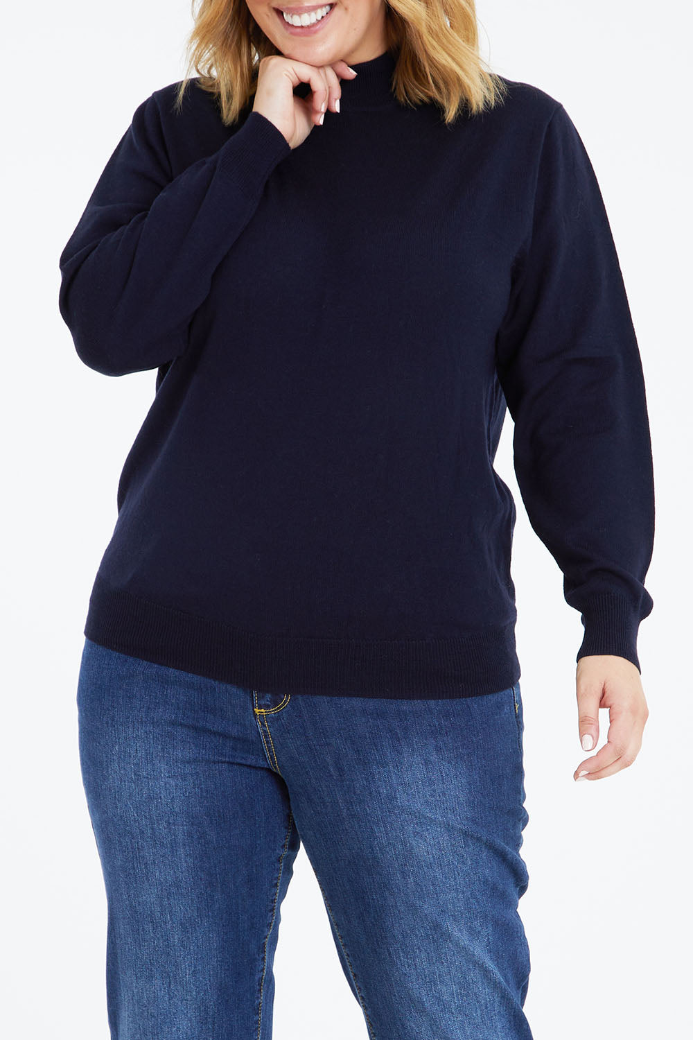 Model Jess wearing size L of the Merino Wool High Crew Pullover in colour Navy (Blue), from the front, cropped image