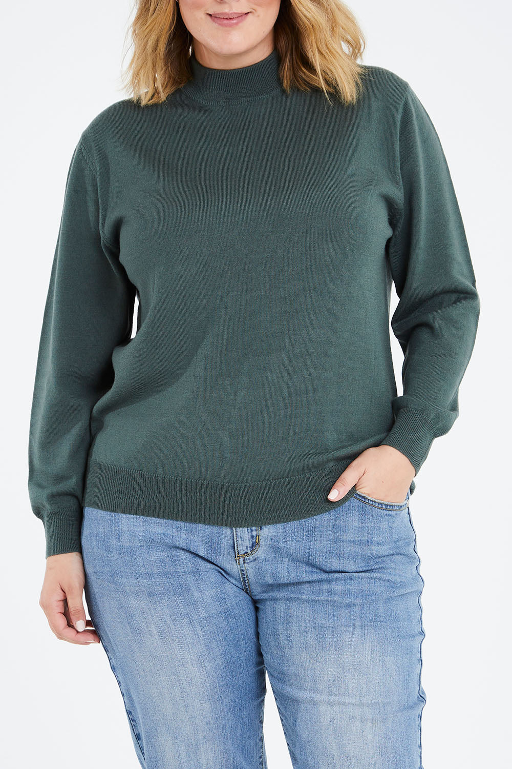 Model Jess wearing size L of the Merino Wool High Crew Pullover in colour Seafoam (Green), from the front, cropped image