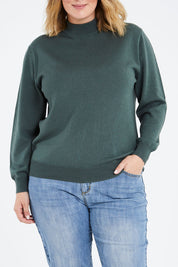 Model Jess wearing size L of the Merino Wool High Crew Pullover in colour Seafoam (Green), from the front, cropped image
