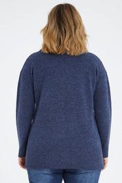 Model Jess wearing size L of the Wool Rolled Neck Jumper in colour Denim (Blue), from the back