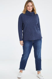 Model Jess wearing size L of the Wool Rolled Neck Jumper in colour Denim (Blue), from the front, showing the whole outfit