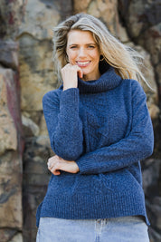 Model Kelly wearing size S of the Wool Rolled Neck Jumper in colour Denim (Blue), from the front, showing the whole outfit