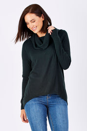 Model Perrie wearing size S of the Natural Rolled Neck Sweater in colour Alpine (Green), from the front, cropped image
