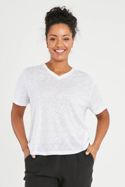 Model Noli wearing size 14 of the Linen V Neck Top in colour White (White), from the front, cropped image