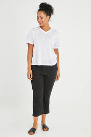 Model Noli wearing size 14 of the Linen V Neck Top in colour White (White), from the front, showing the whole outfit