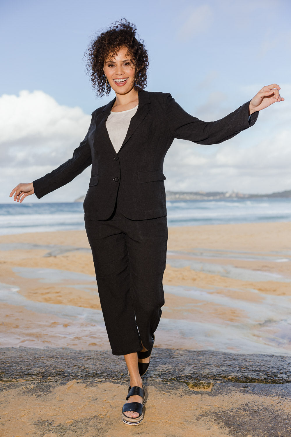 Model Lala wearing size 10 of the Linen Blazer in colour Black (Black), from the front, showing the whole outfit