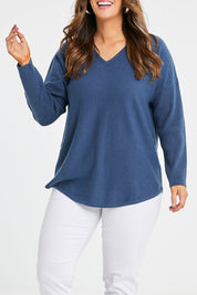 Model Laura wearing size S of the Wool Cashmere Sweater in colour Denim (Blue), from the front, cropped image