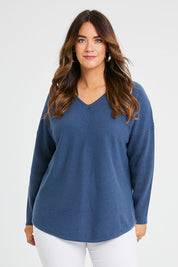 Model Laura wearing size S of the Wool Cashmere Sweater in colour Denim (Blue), from the front, cropped image