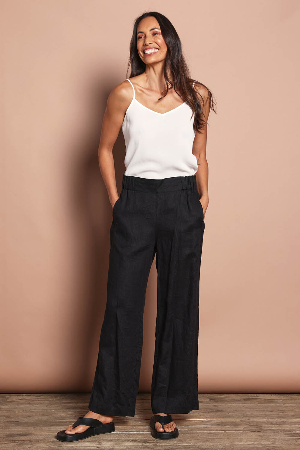 Model Amanda wearing size 10 of the Linen Wide Leg Pant in colour Black (Black), from the front, showing the whole outfit