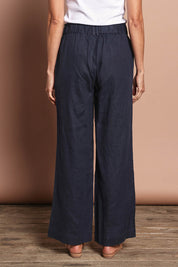 Model Amanda wearing size 10 of the Linen Wide Leg Pant in colour Navy (Blue), from the back