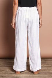 Model Amanda wearing size 10 of the Linen Wide Leg Pant in colour White (White), from the back