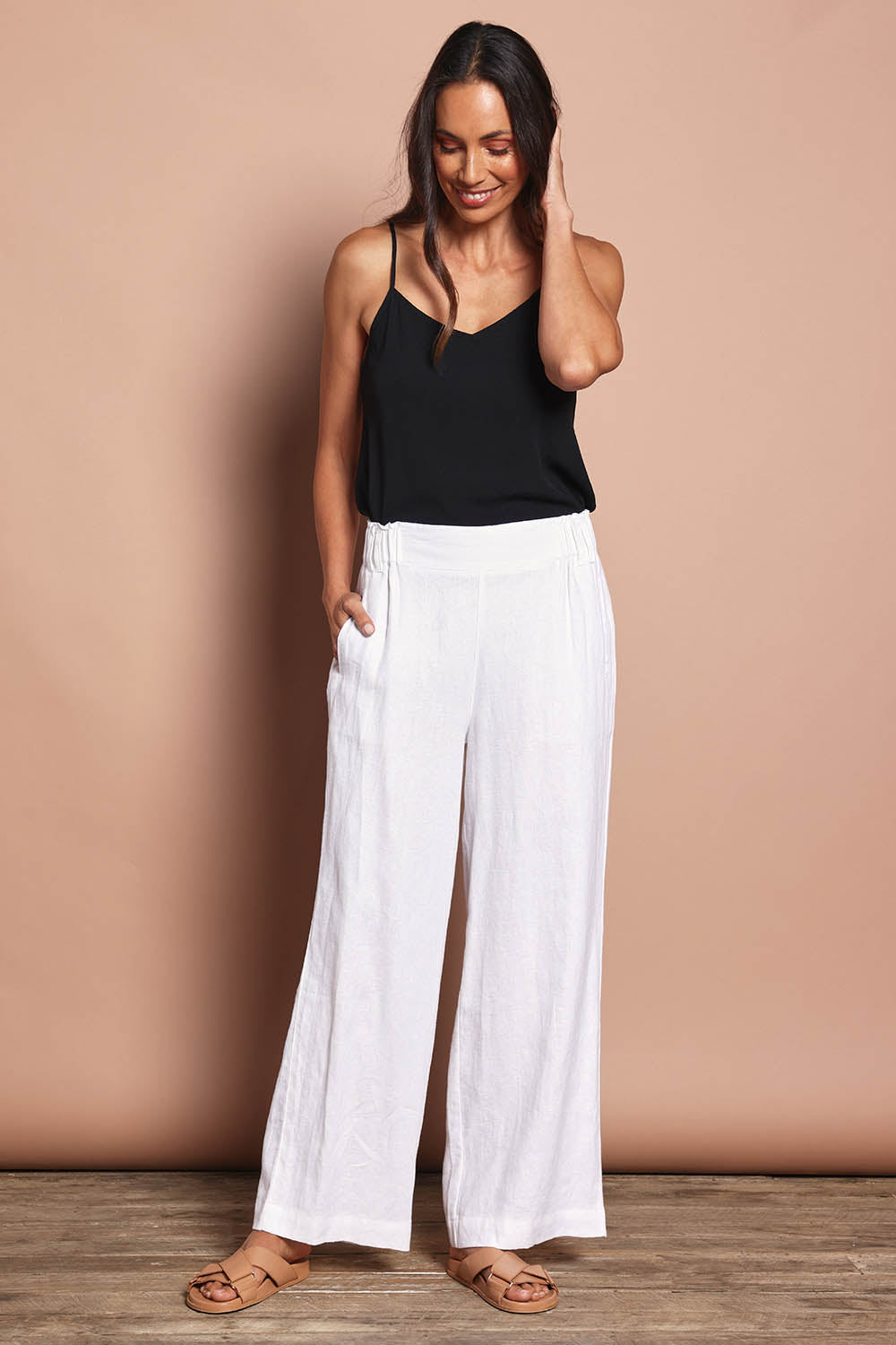 Model Amanda wearing size 10 of the Linen Wide Leg Pant in colour White (White), from the front, showing the whole outfit