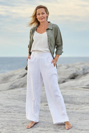 Model Bianca wearing size 10 of the Linen Wide Leg Pant in colour White (White), from the front, showing the whole outfit