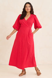 Model Tahnee wearing size 10 of the Linen Cotton Puff Sleeve Wrap Dress in colour Rubyred (Red), from the front, showing the whole outfit