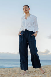 Model Lala wearing size 10 of the Linen Relaxed Pants in colour Navy (Blue), from the front, showing the whole outfit