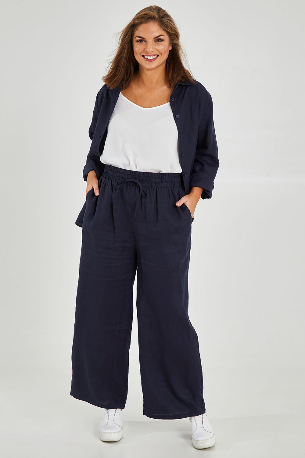 Model Monique wearing size 14 of the Linen Relaxed Pants in colour Navy (Blue), from the front, showing the whole outfit