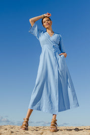 Model Lala wearing size 10 of the Linen Cotton Blend Short Sleeve Wrap Dress in colour Lightblue (Blue), from the front, showing the whole outfit