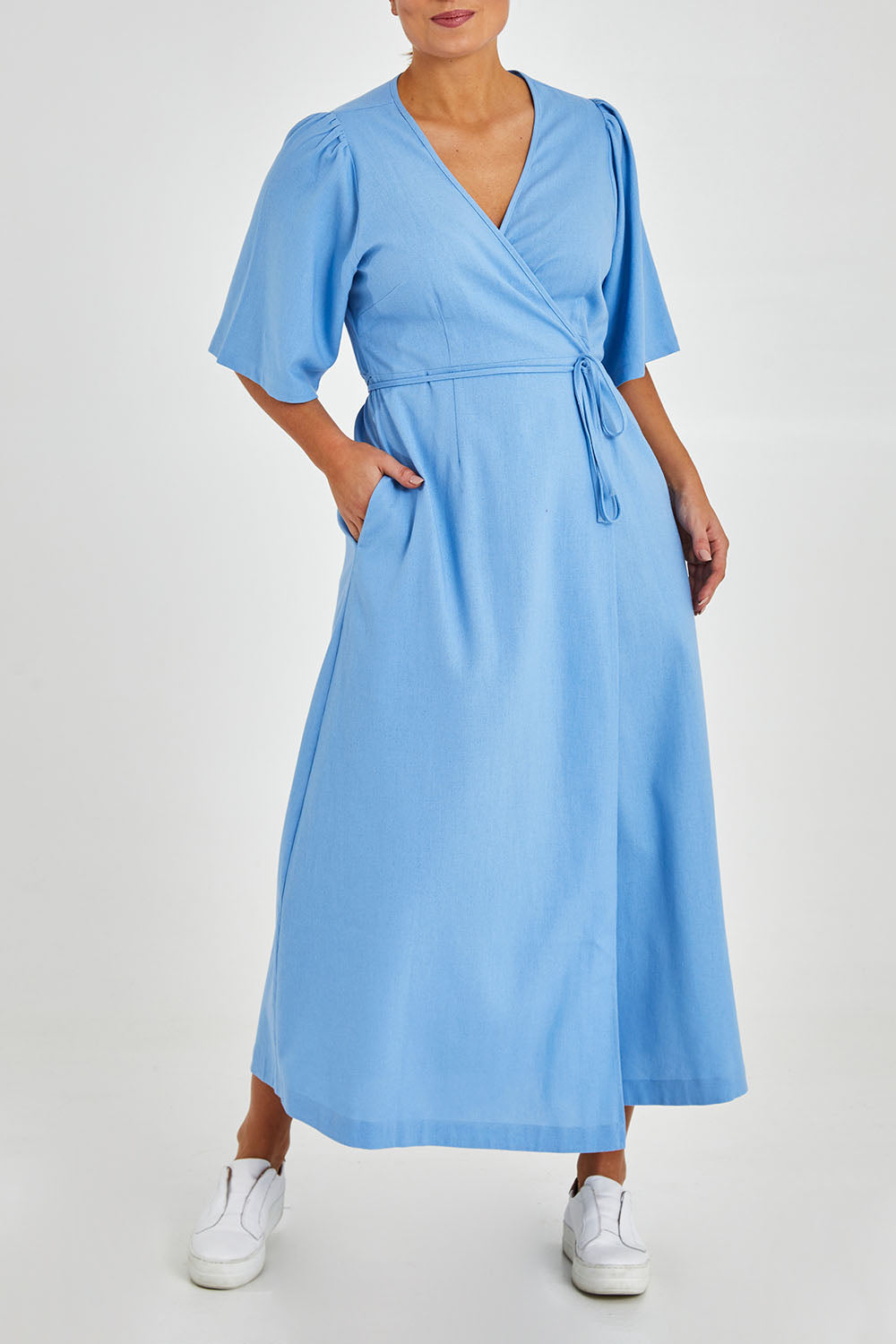 Model Monique wearing size 14 of the Linen Cotton Blend Short Sleeve Wrap Dress in colour Lightblue (Blue), from the front, cropped image