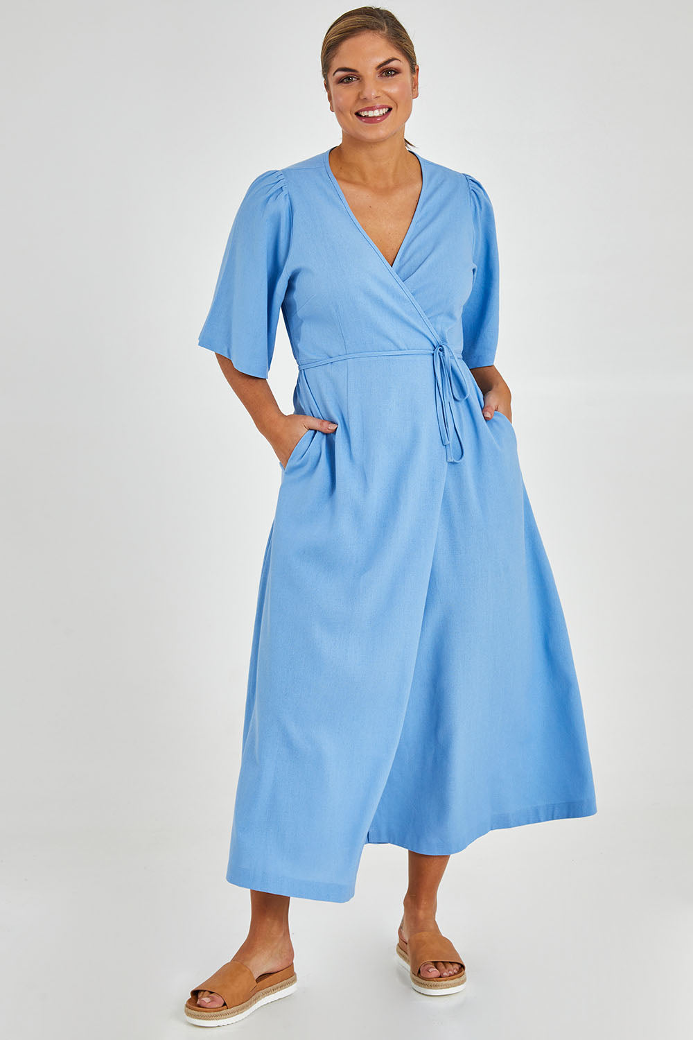 Model Monique wearing size 14 of the Linen Cotton Blend Short Sleeve Wrap Dress in colour Lightblue (Blue), from the front, showing the whole outfit