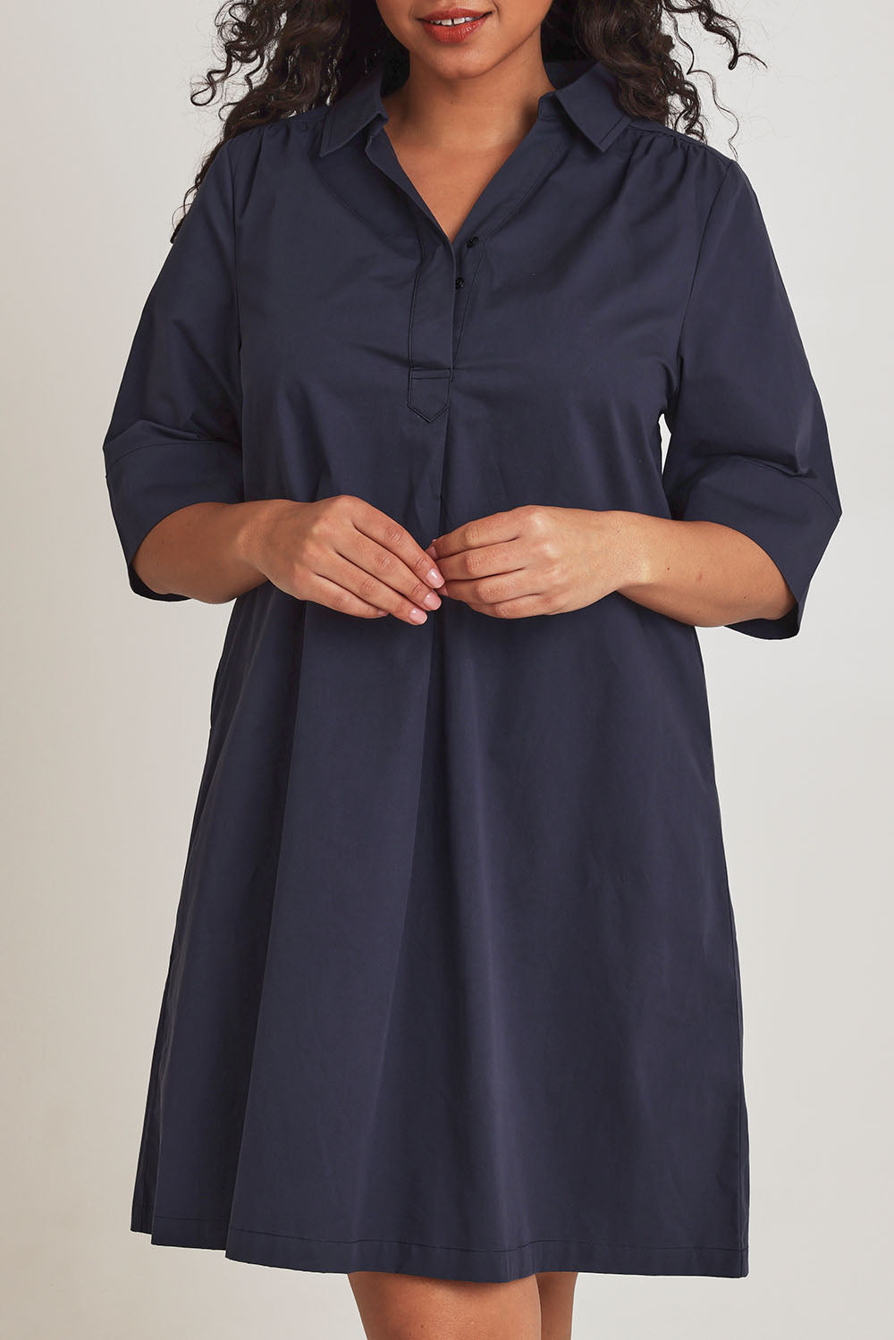 Model Terri-Leigh wearing size 14 of the Cotton Poplin Swing Dress in colour Dustyblue (Blue), from the front, cropped image