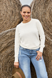 Model Lala wearing size S of the Cotton Cashmere Crew Neck Sweater in colour Snow (White), from the front, showing the whole outfit