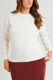 Model Laura wearing size L of the Cotton Cashmere Crew Neck Sweater in colour Snow (White), from the front, cropped image