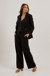 Model Amanda wearing size 10 of the Ramie Tencel Blazer in colour Black (Black), from the front, showing the whole outfit