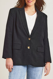 Model Jane wearing size 14 of the Ramie Tencel Blazer in colour Black (Black), from the front, cropped image