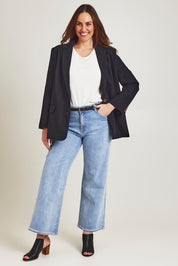 Model Jane wearing size 14 of the Ramie Tencel Blazer in colour Black (Black), from the front, showing the whole outfit