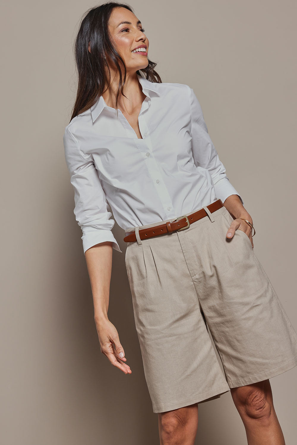 Model Amanda wearing size 10 of the Linen Cotton Long Short in colour Stone, from the front, cropped image