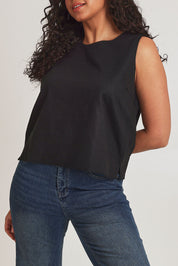 Model Terri-Leigh wearing size 14 of the Linen Cotton Split Hem Tank in colour Black (Black), from the front, cropped image