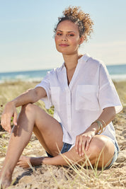 Model Lala wearing size 10 of the Linen Cotton Relaxed Shirt in colour White (White), from the front, showing the whole outfit