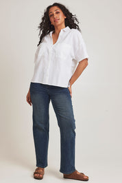 Model Terri-Leigh wearing size 14 of the Linen Cotton Relaxed Shirt in colour White (White), from the front, showing the whole outfit