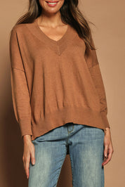 Model Madeline wearing size S of the Cotton Cashmere V Neck Sweater in colour Caramel, from the front, cropped image