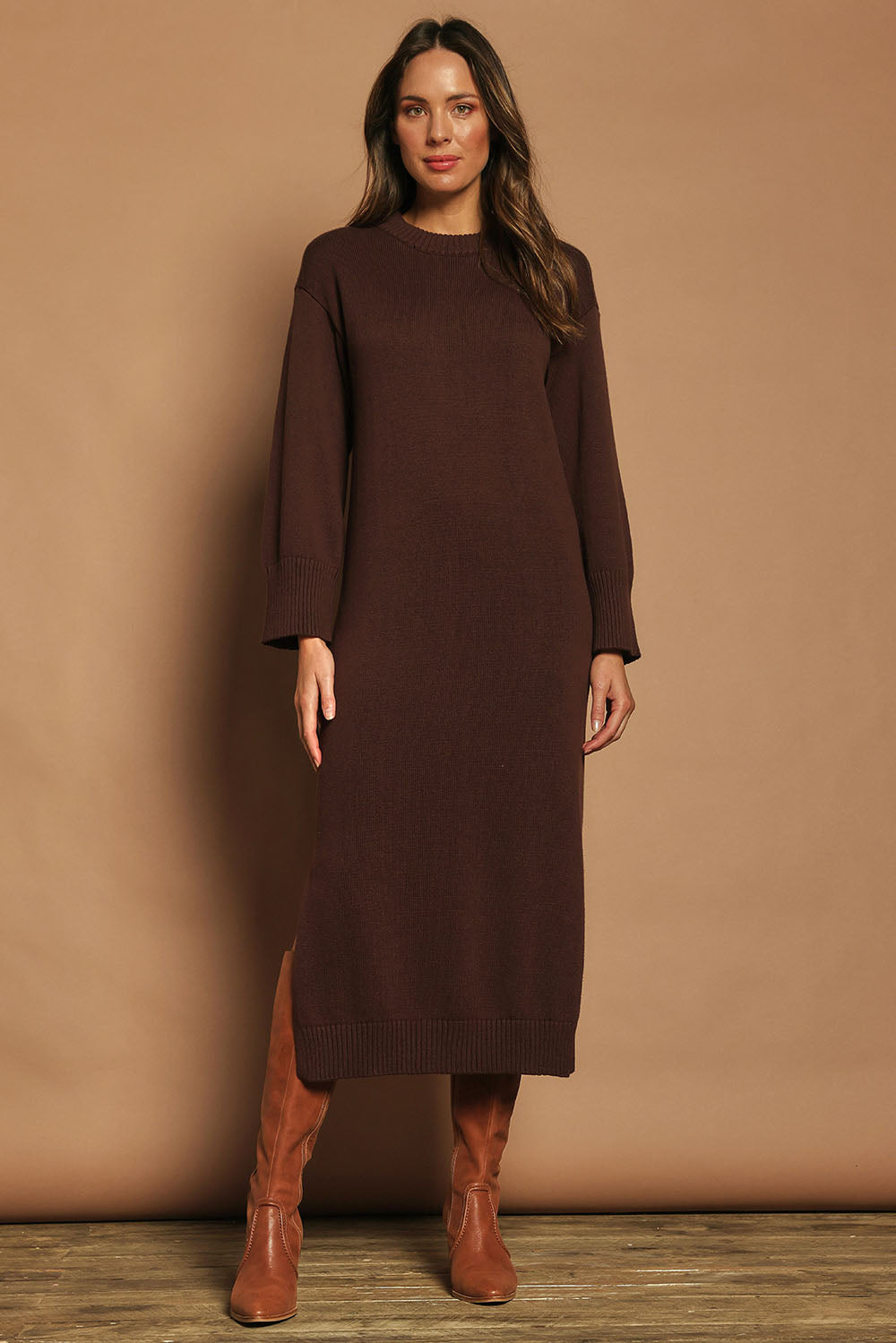 Model Madeline wearing size S of the Cotton Wool Cashmere Jumper Dress in colour Coco, from the front, showing the whole outfit