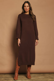 Model Madeline wearing size S of the Cotton Wool Cashmere Jumper Dress in colour Coco, from the front, showing the whole outfit