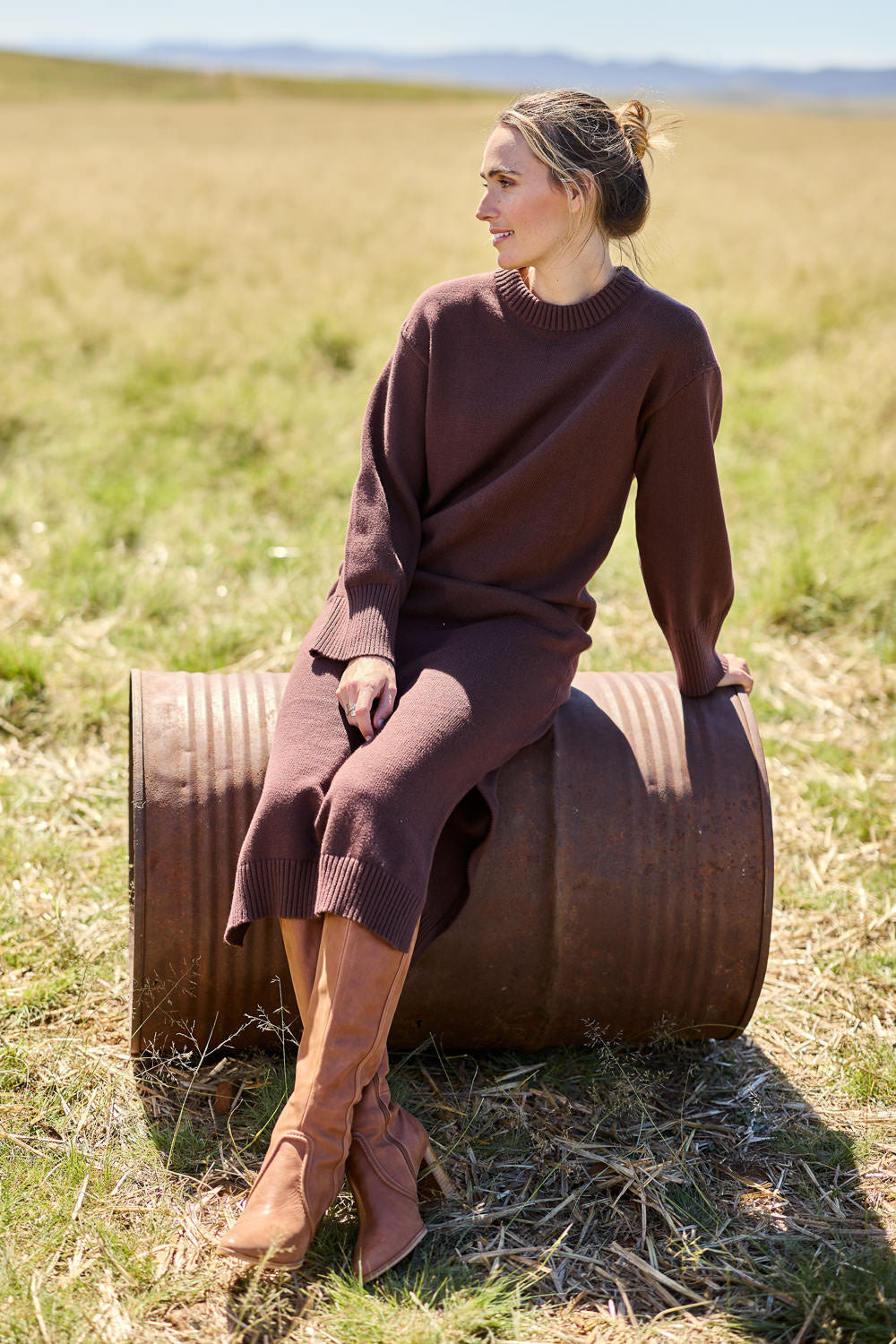 Model Tegan wearing size S of the Cotton Wool Cashmere Jumper Dress in colour Coco, from the front, showing the whole outfit