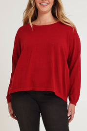 Model Chanel wearing size XL of the Cotton Cashmere Cross Back Sweater in colour Redrust (Red), from the front, cropped image