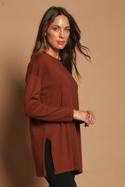 Model Madeline wearing size S of the Cotton Cashmere Tunic in colour Chestnut, from the front, showing the whole outfit