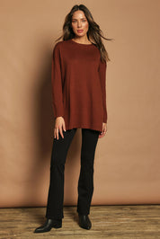 Model Madeline wearing size S of the Cotton Cashmere Tunic in colour Chestnut, from the front, showing the whole outfit