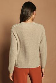 Model Madeline wearing size S of the Wool Cashmere Shoulder Cable Knit Sweater in colour Fawn, from the back