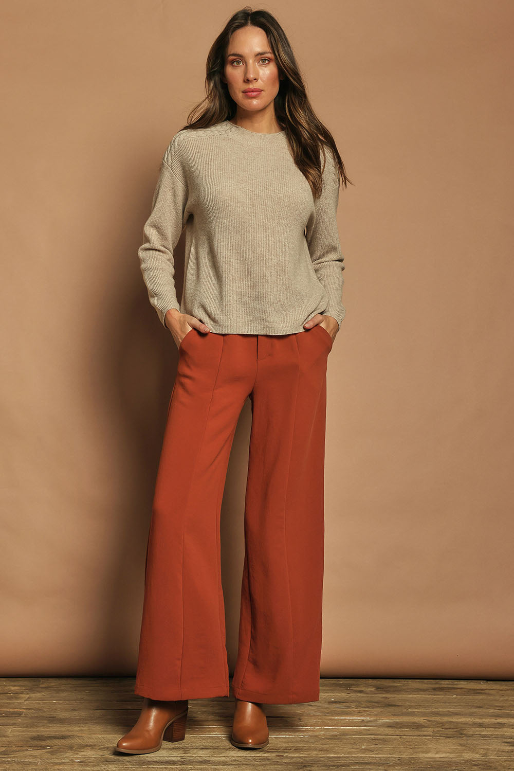 Model Madeline wearing size S of the Wool Cashmere Shoulder Cable Knit Sweater in colour Fawn, from the front, showing the whole outfit