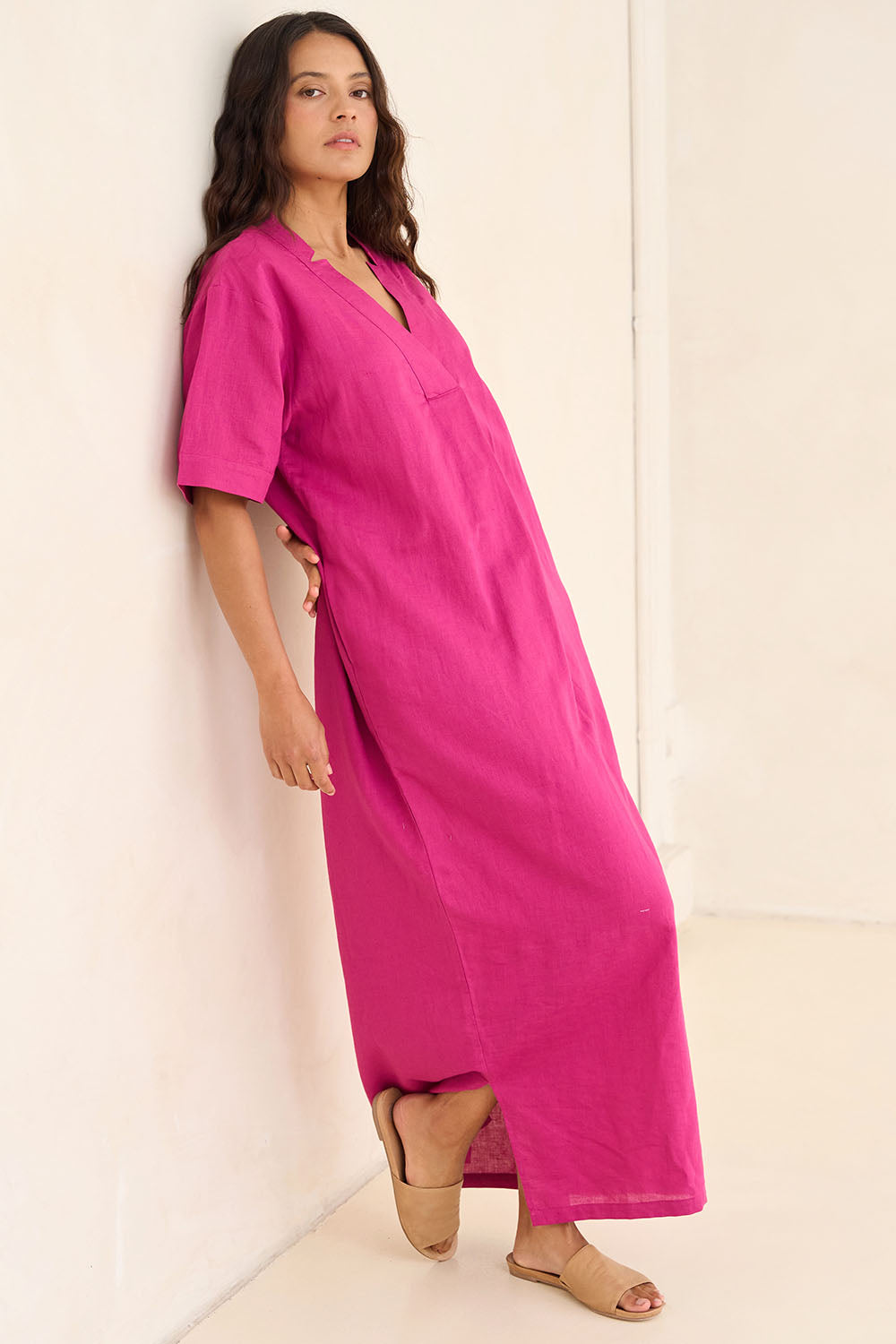 Model Tahnee wearing size 10 of the Linen Cotton V Neck Maxi Dress in colour Magenta (Pink), from the front, showing the whole outfit