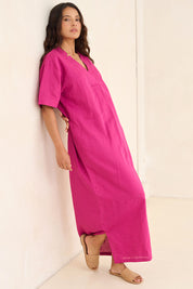 Model Tahnee wearing size 10 of the Linen Cotton V Neck Maxi Dress in colour Magenta (Pink), from the front, showing the whole outfit